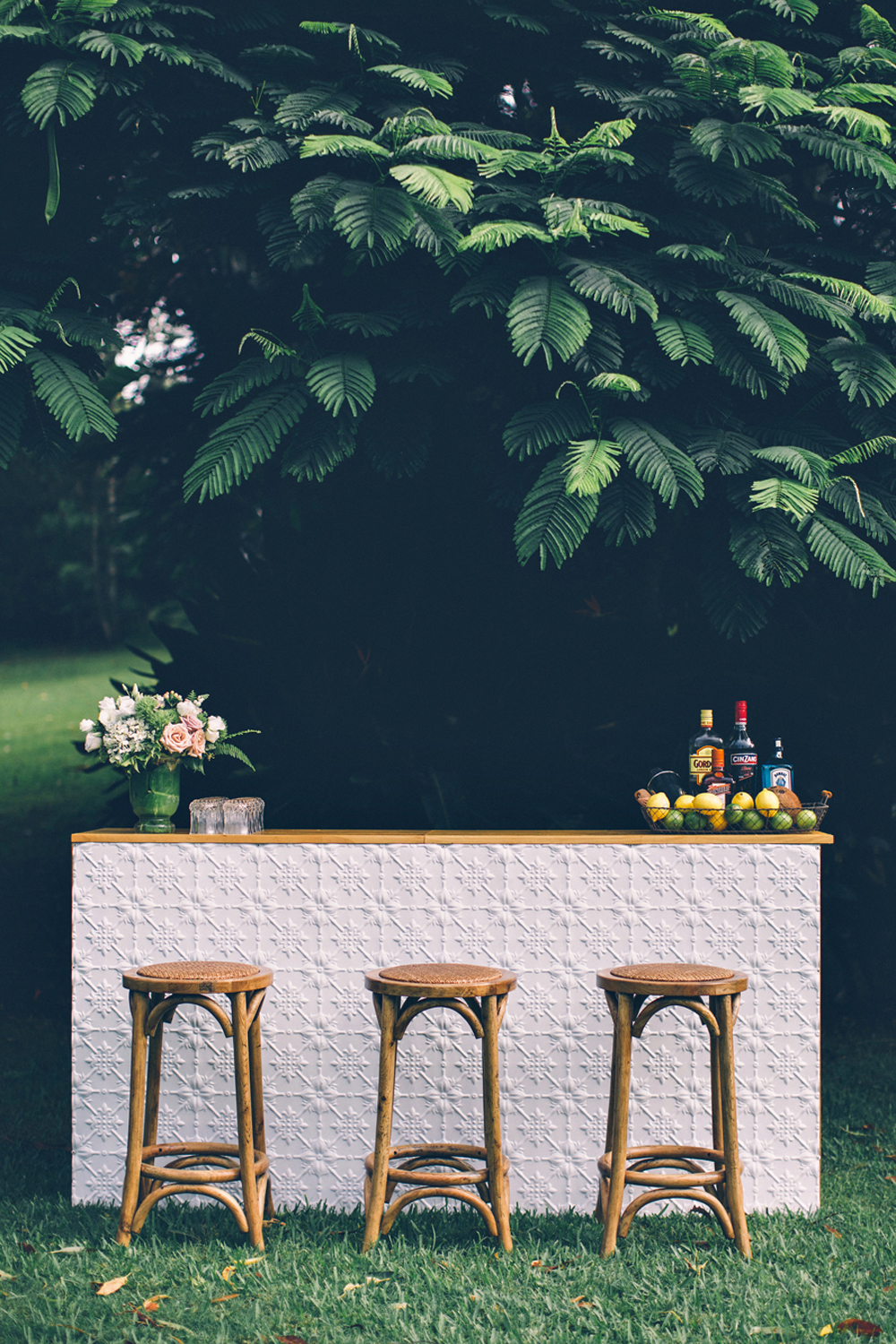 British Empire Shoot.  Pressed tin bar and rattan bar stools from Lovestruck Weddings